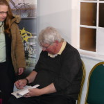 Tim Wander signing books